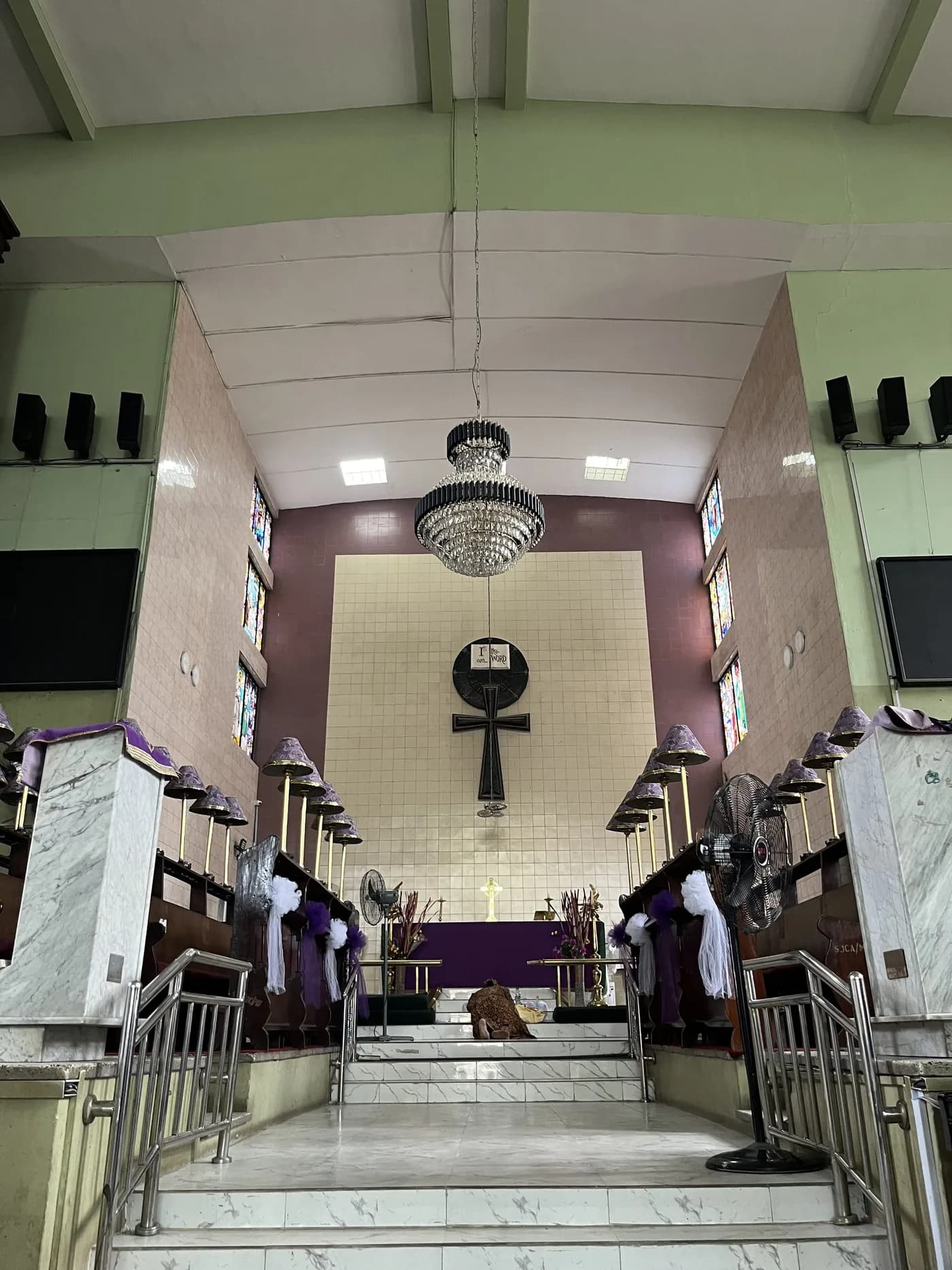 Interior view toward the altar cross and chandelier